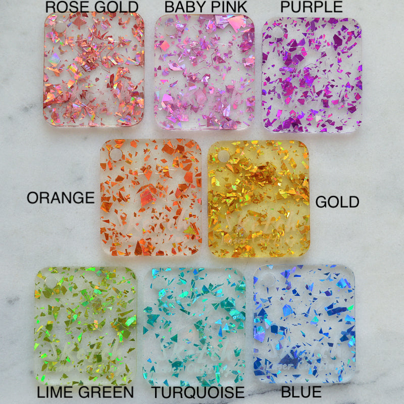 Conjunto de muestra de material: purpurina transparente con fragmentos gruesos de discoteca (muestras x10)