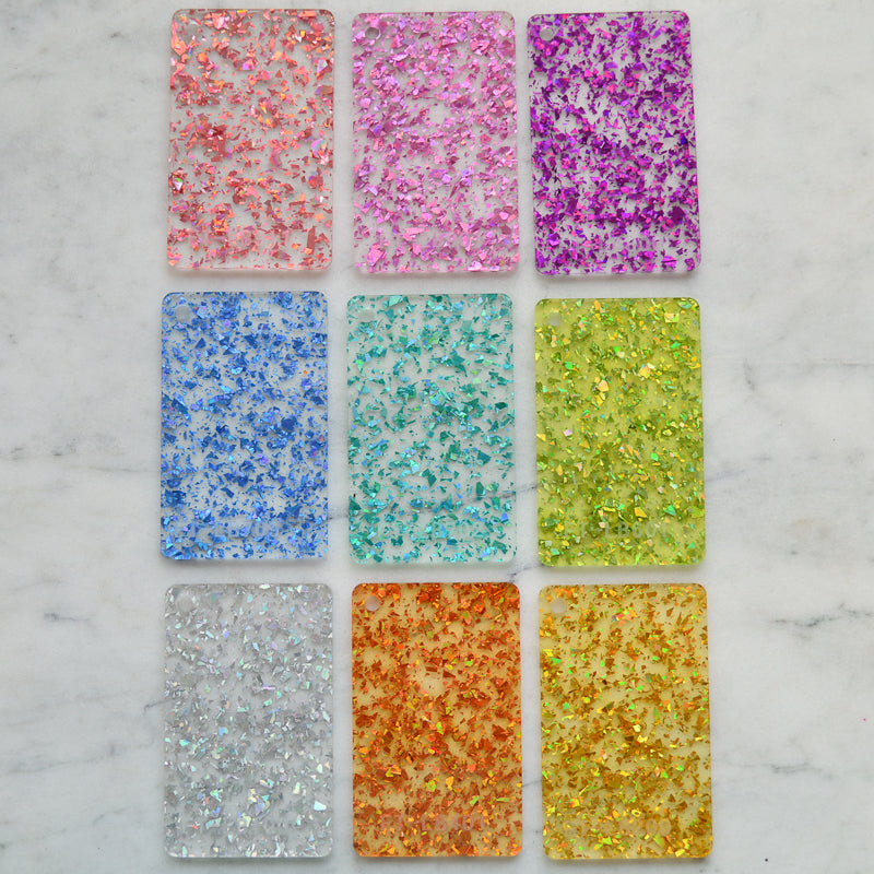 Conjunto de muestra de material: purpurina transparente con fragmentos gruesos de discoteca (muestras x10)